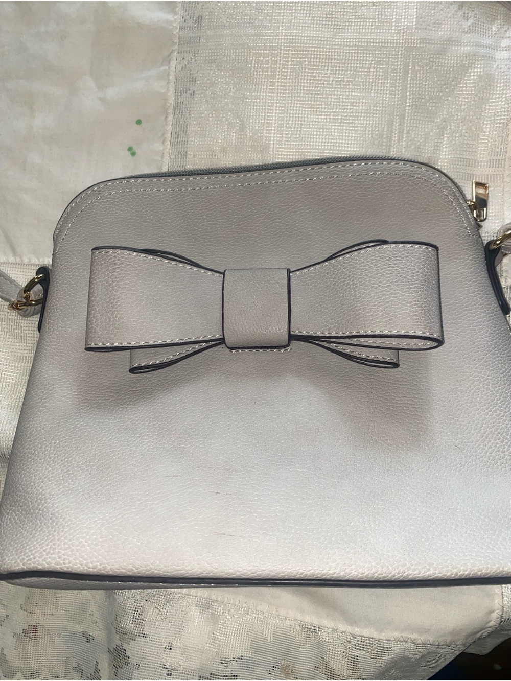 Gray dome-shaped crossbody bag featuring a large bow accent. New. - Picture 2 of 4